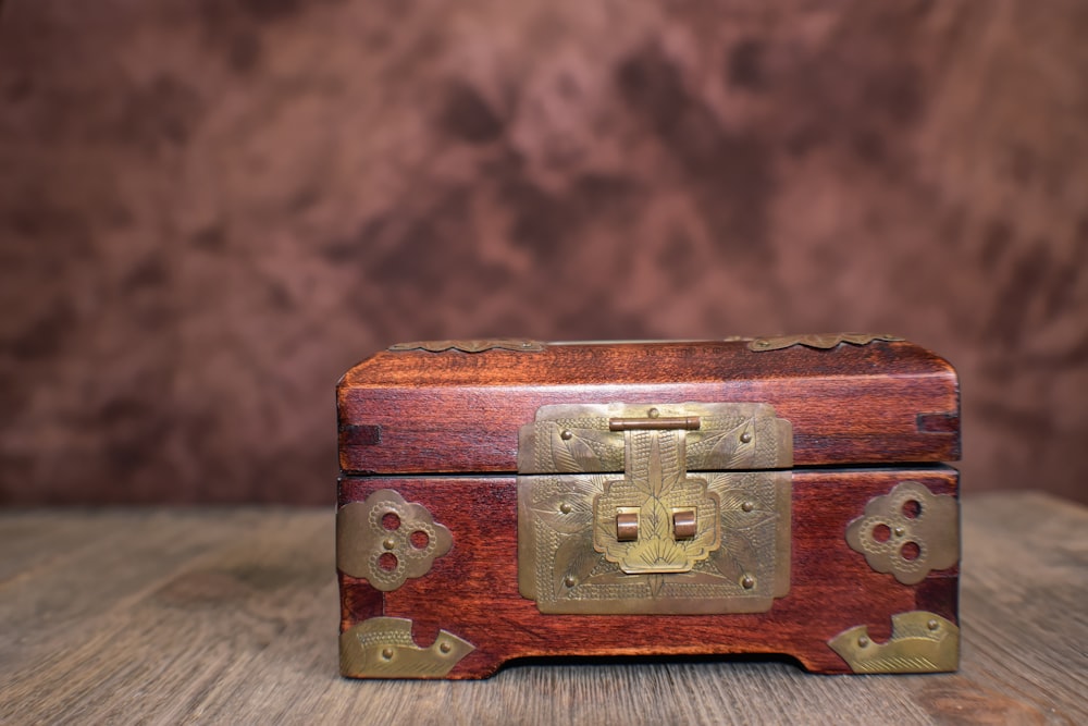 a wooden box sitting on top of a wooden table