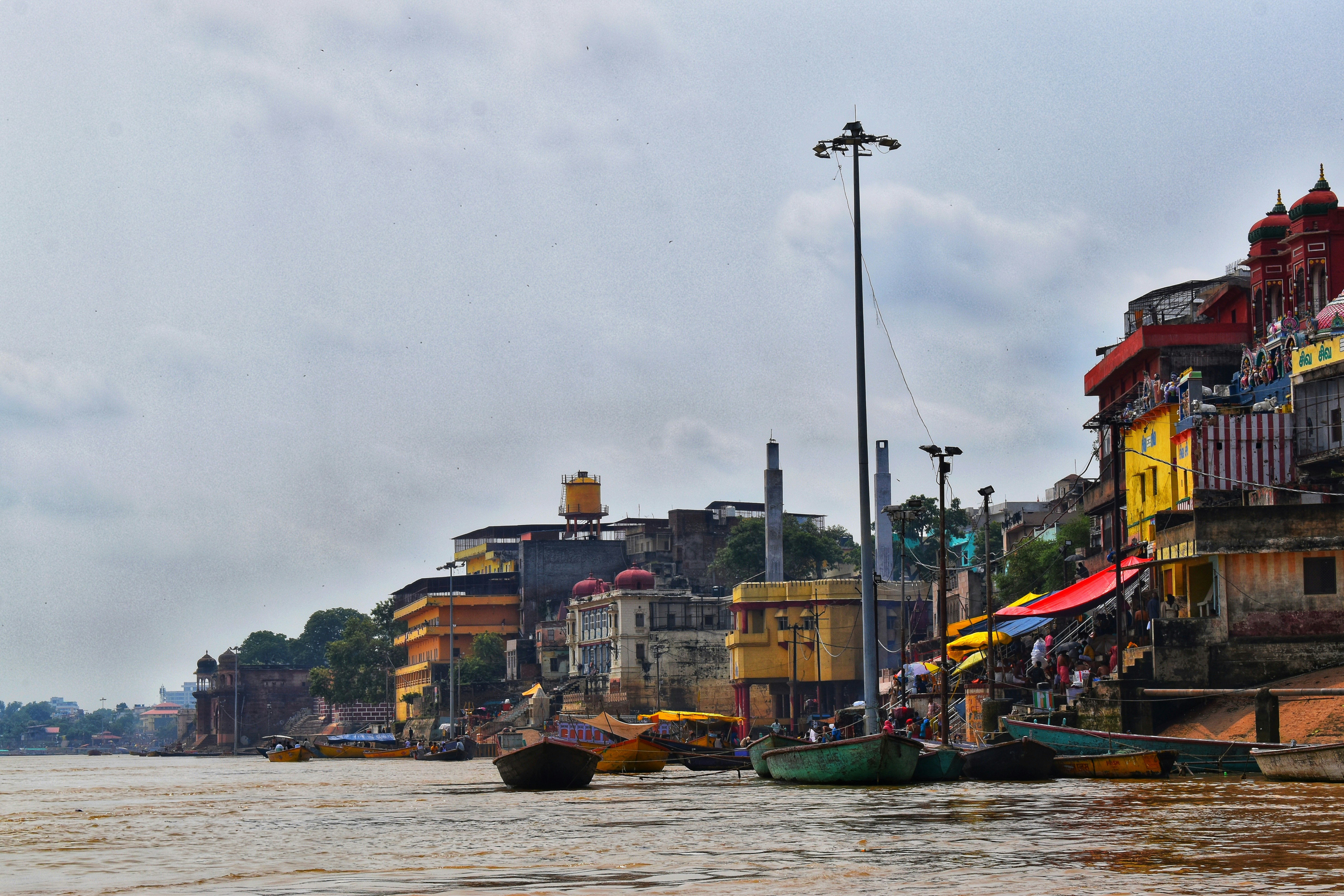 a group of boats floating on top of a river