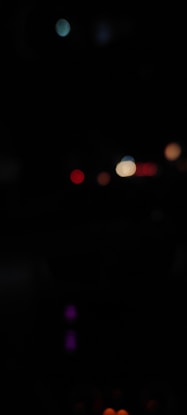 a blurry photo of a street light at night