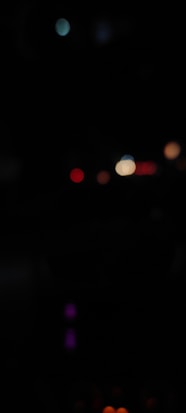 a blurry photo of a street light at night