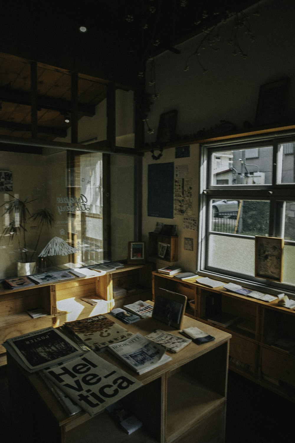 a room filled with lots of clutter next to a window