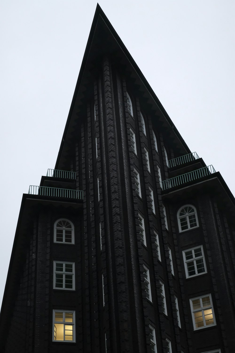 a very tall building with a clock on it's side