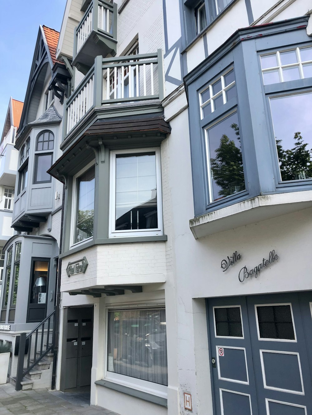 a row of buildings with a sign on the side of the building