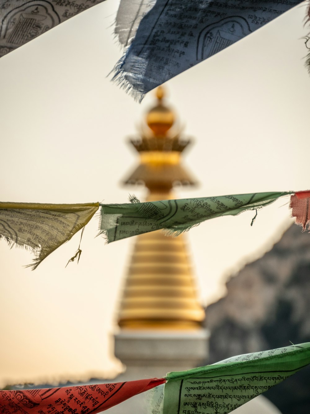 a group of colorful flags flying in the air