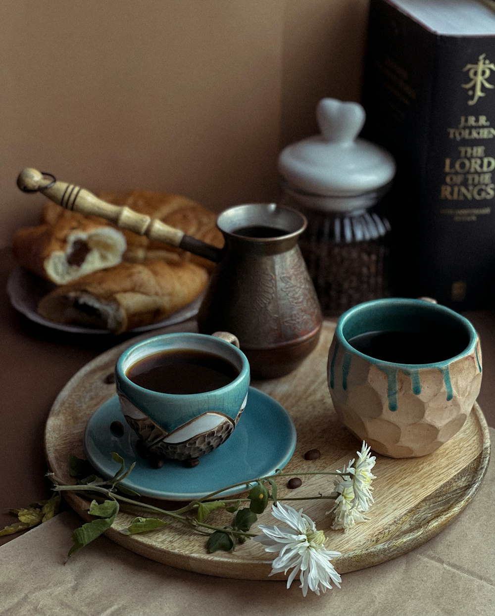 a couple of cups of coffee on a tray