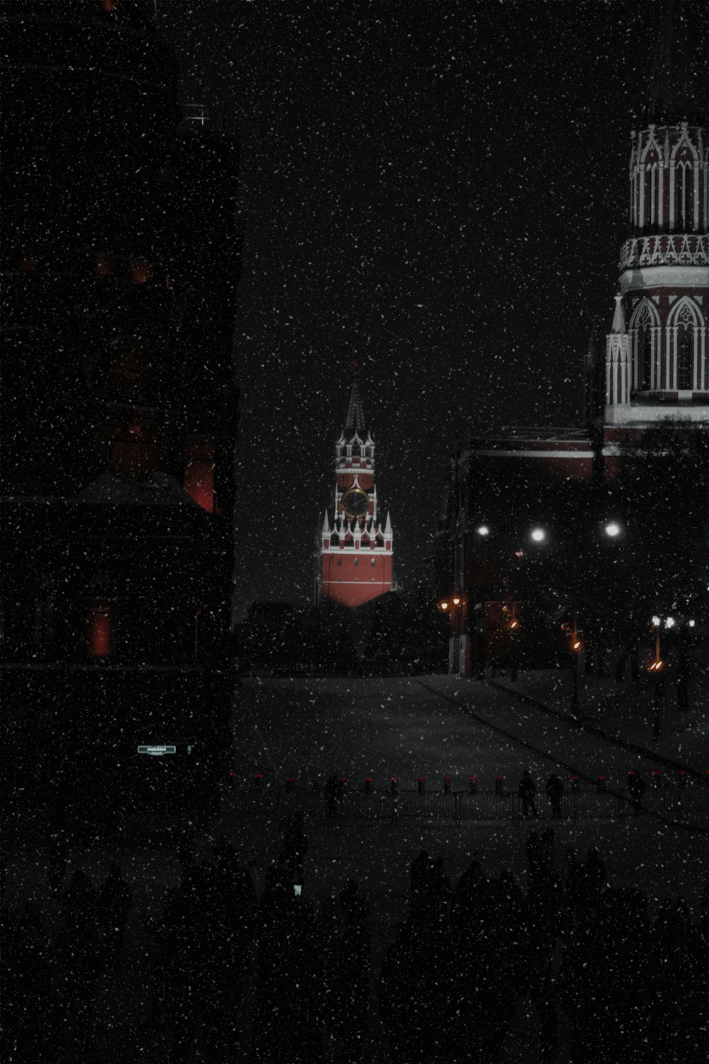 a large building with a clock tower at night