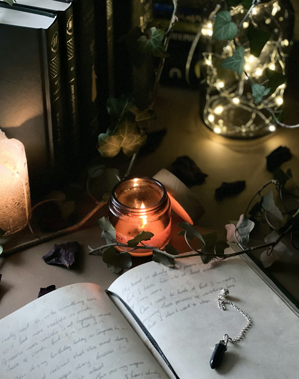 a candle and a book on a table
