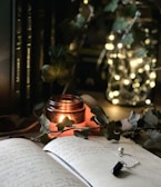 A cozy corner with a soft blanket, a candle, and a journal open to a fresh page.