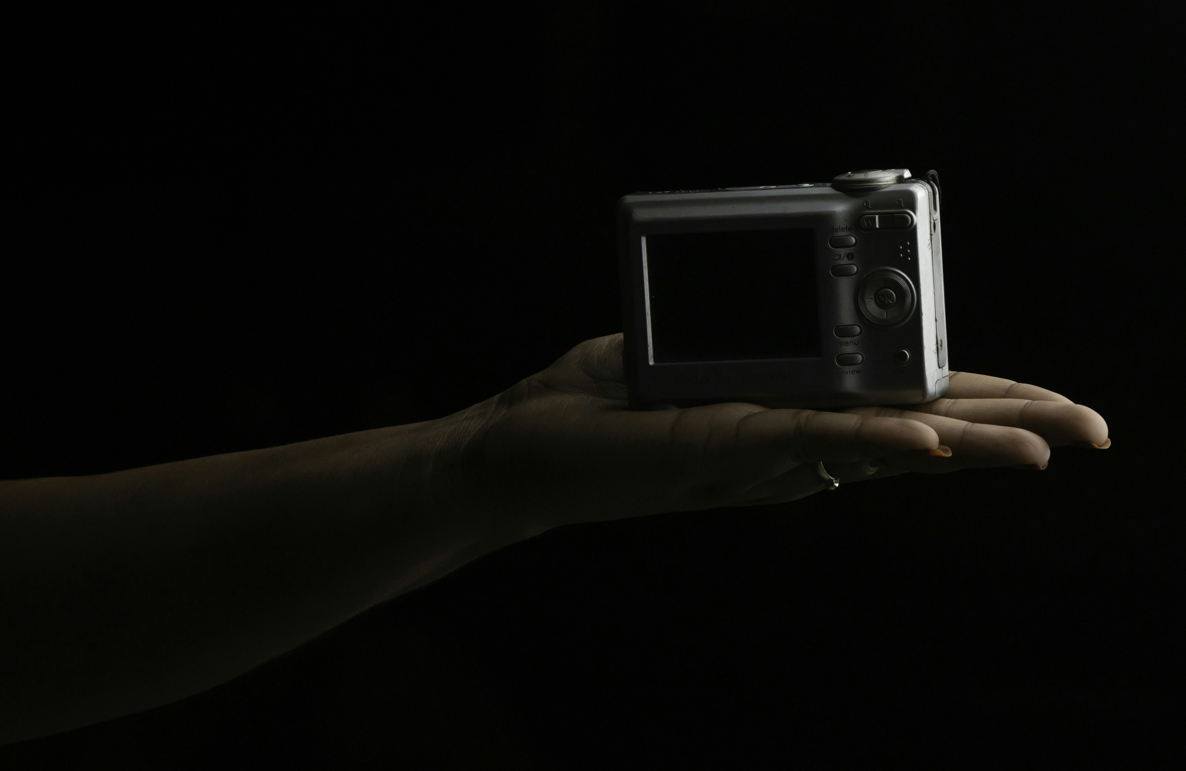 a person holding a camera in their hand