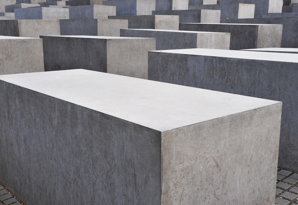 a group of cement blocks sitting on top of a sidewalk