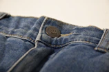 a button on the back of a pair of jeans