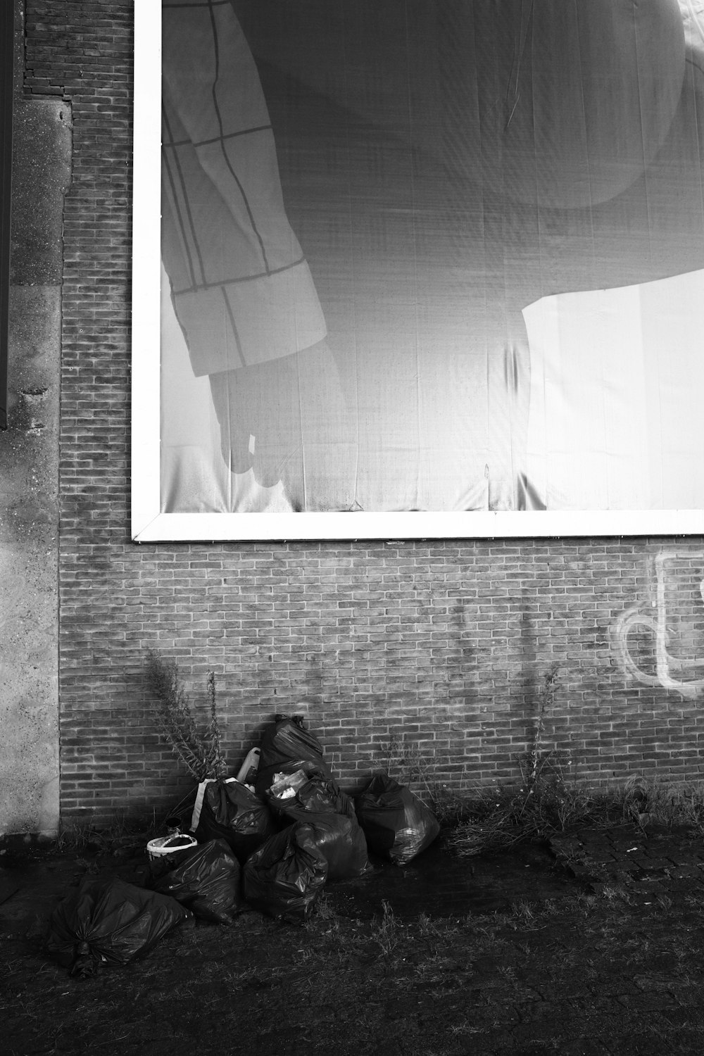 a black and white photo of a building with a large window