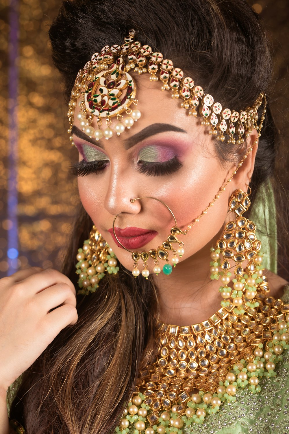 a woman wearing a gold and green costume