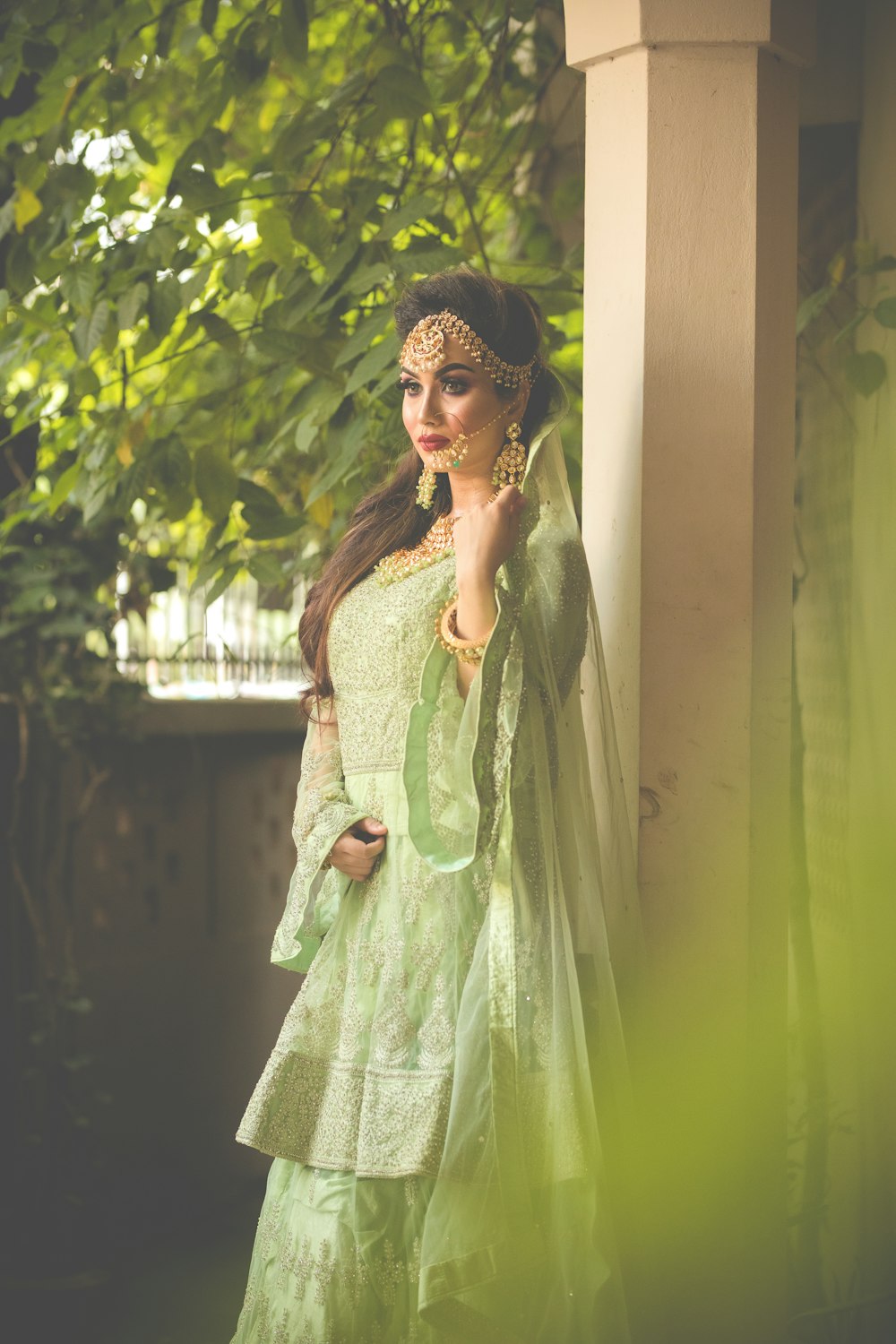 a woman in a green outfit posing for a picture