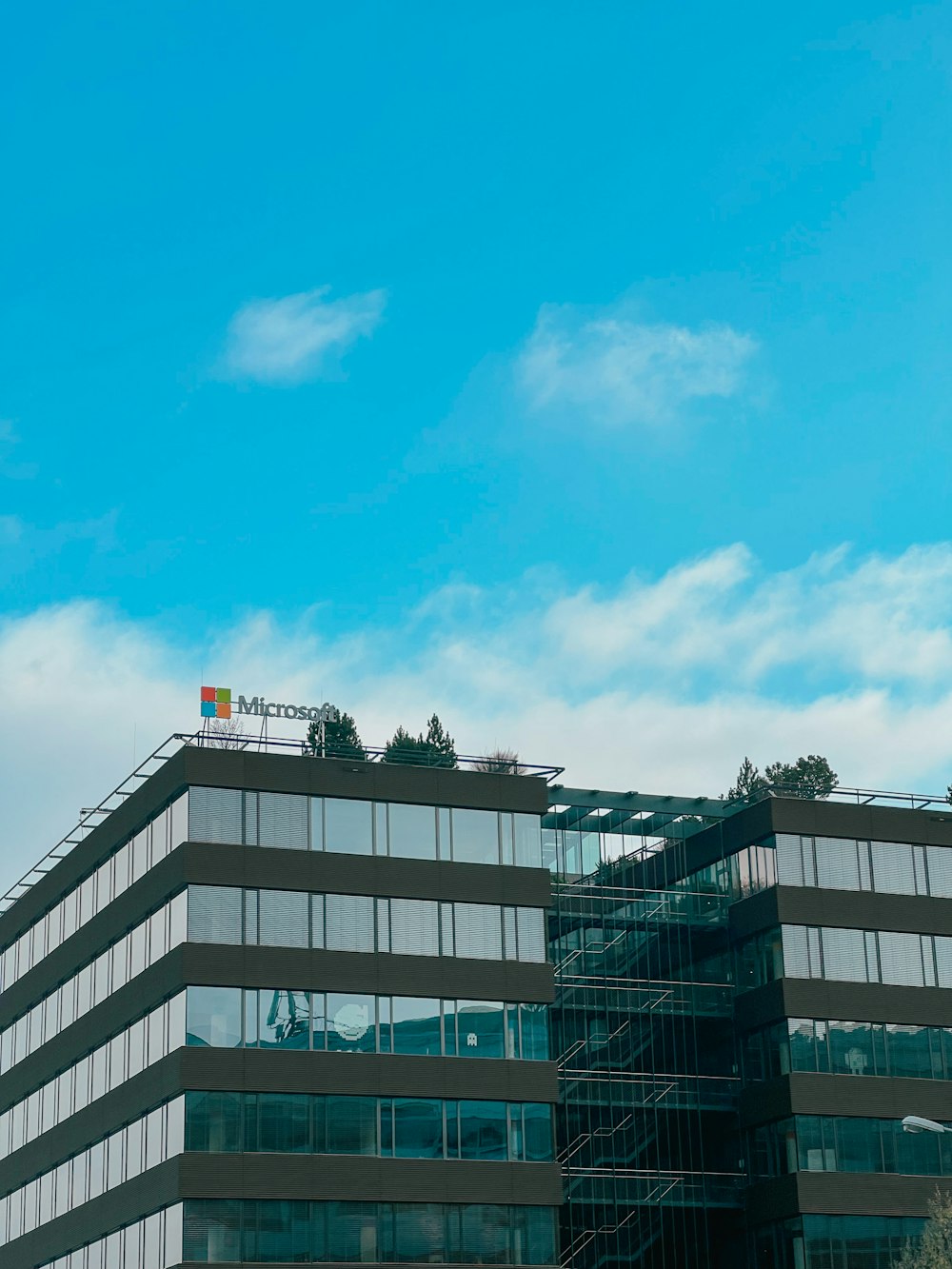 a tall building with a flag on top of it