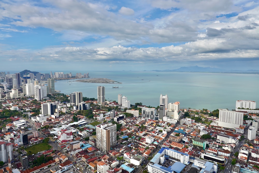 an aerial view of a city and a body of water