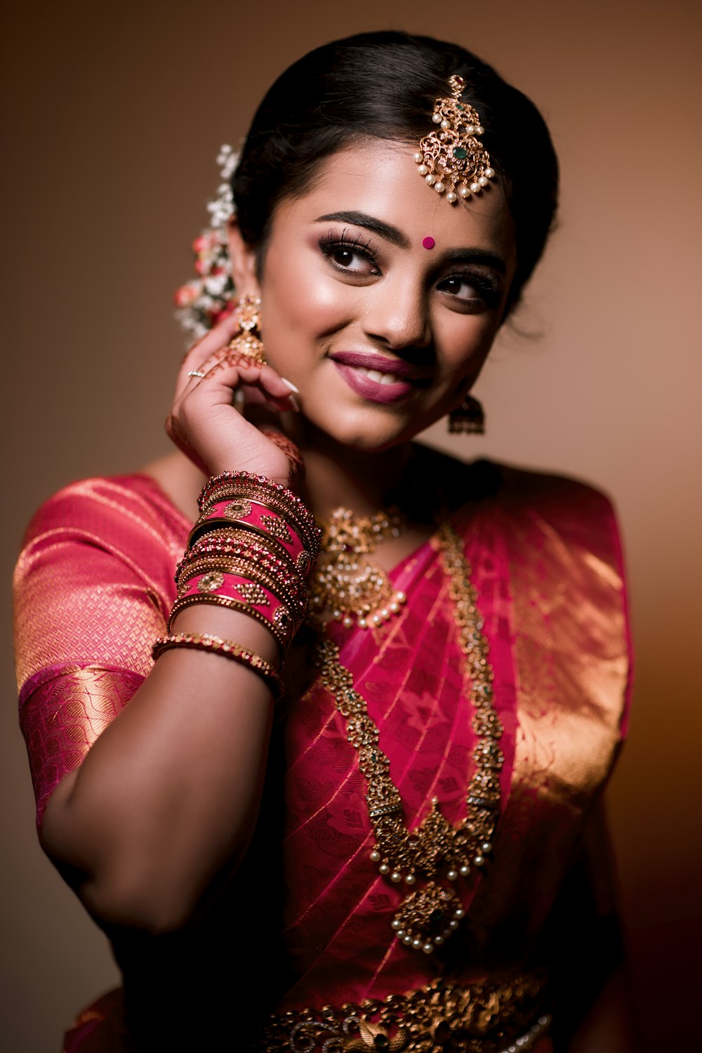 a woman in a red and gold outfit