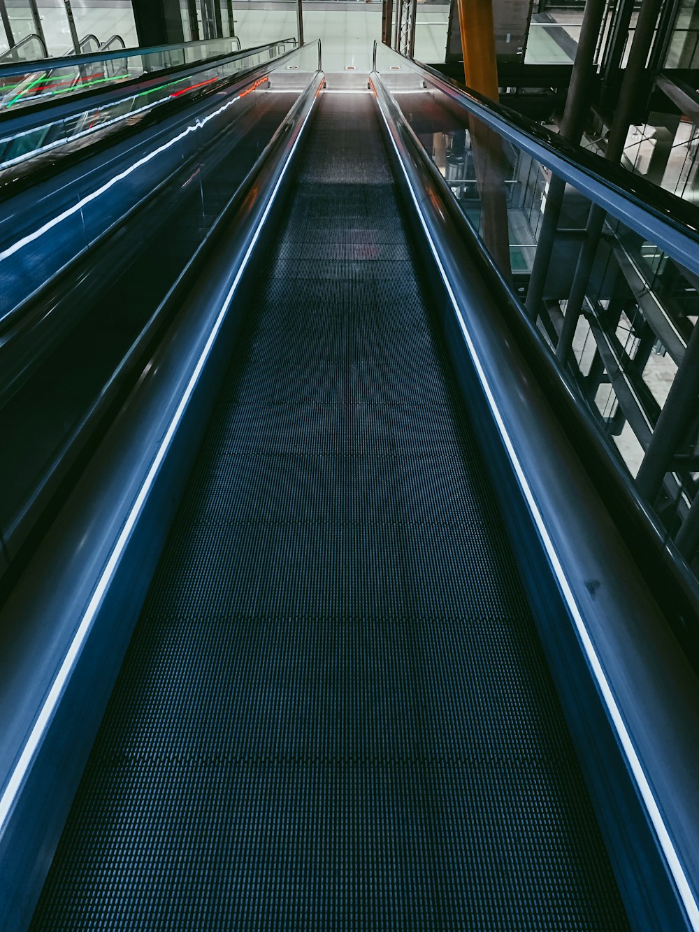a view of an escalator in a train station