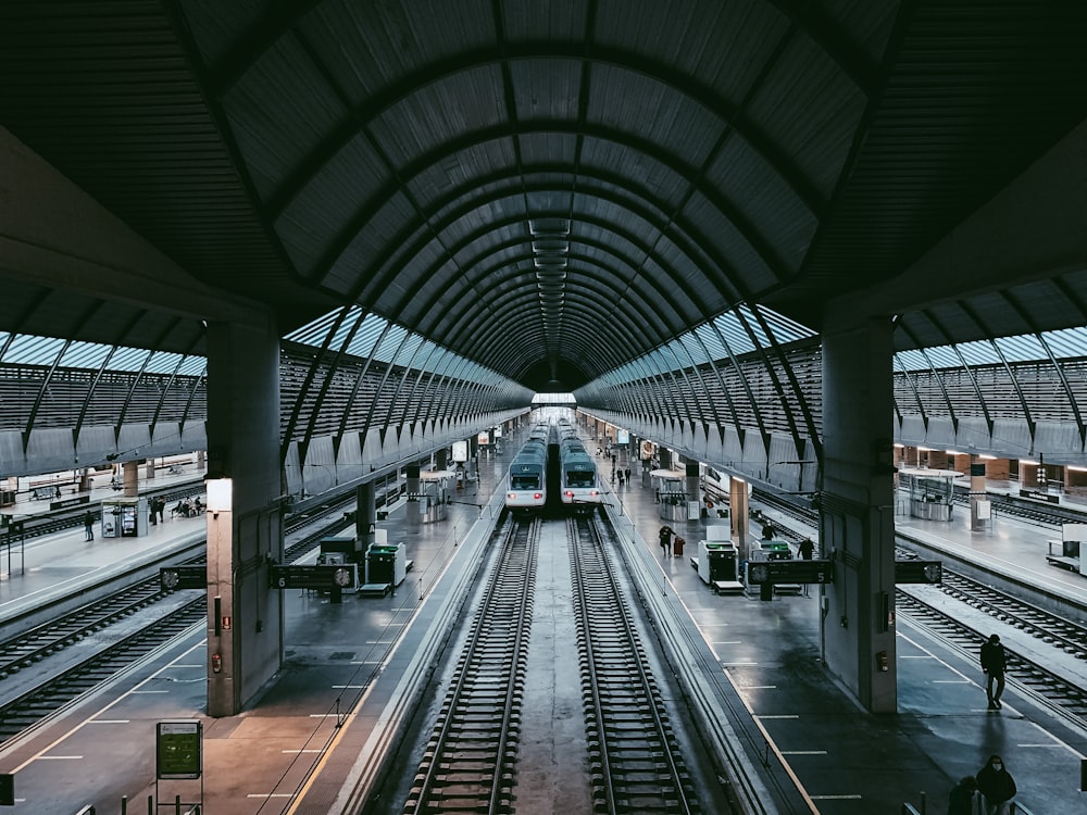 a train station with a train on the tracks