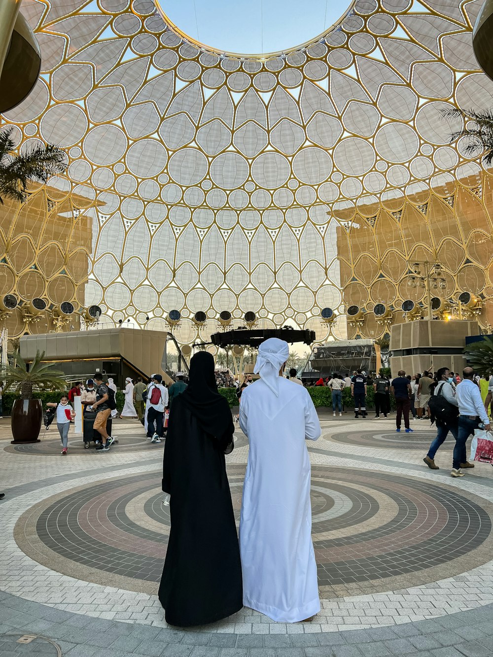 a couple of people that are standing in front of a building