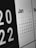 A calendar displayed prominently showing the month of January 2022. The days of the week are detailed, with the date 17th highlighted in gold color. Adjacent months and the year 2022 are also partially visible.