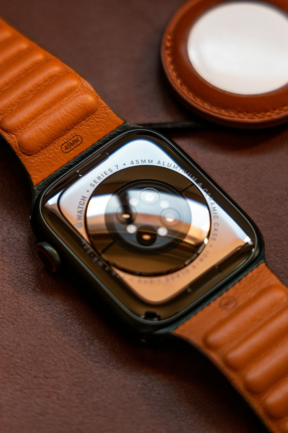 an apple watch sitting on top of a brown table