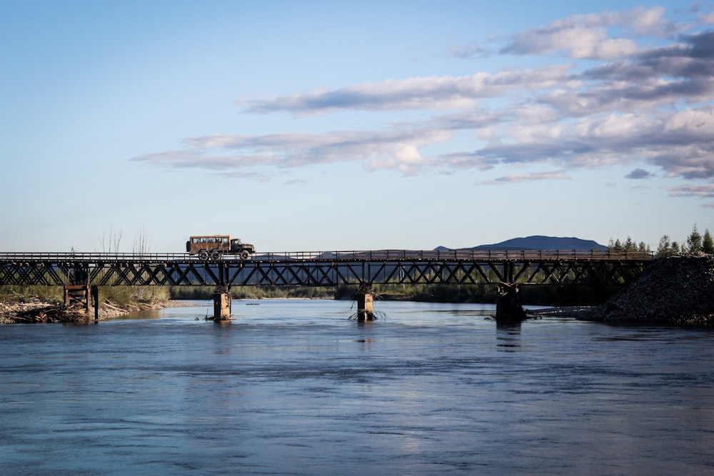 a train crossing a bridge over a river