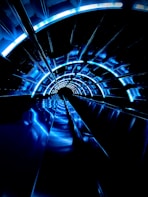 a tunnel with blue lights in the middle of it