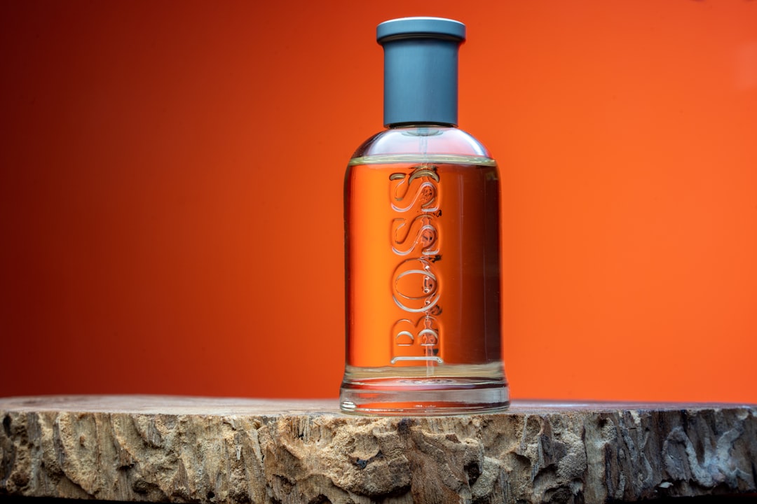 a bottle of soap sitting on top of a wooden table,