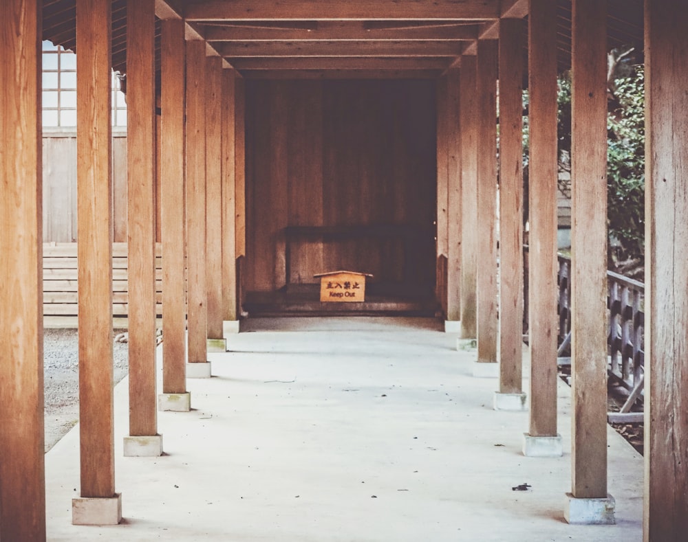 a wooden structure with a bench in it