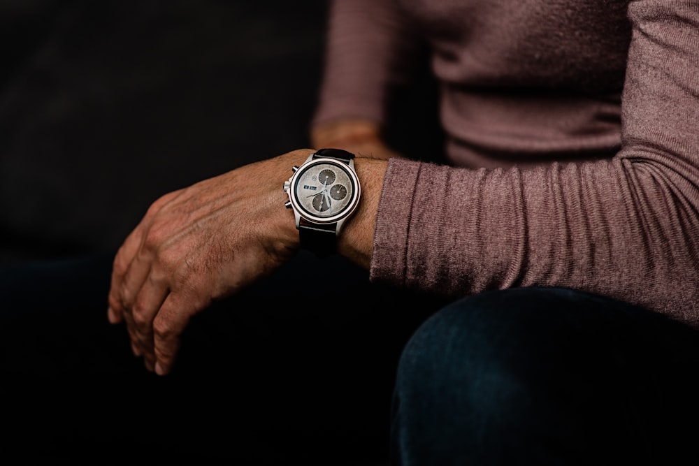 a man with a watch on his wrist