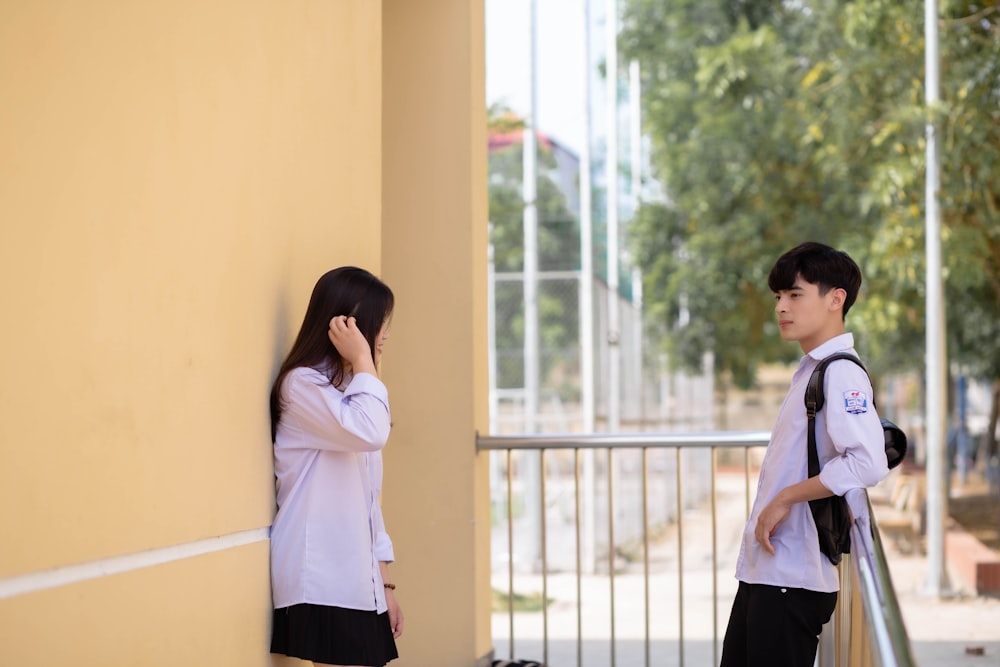 a couple of kids standing next to each other