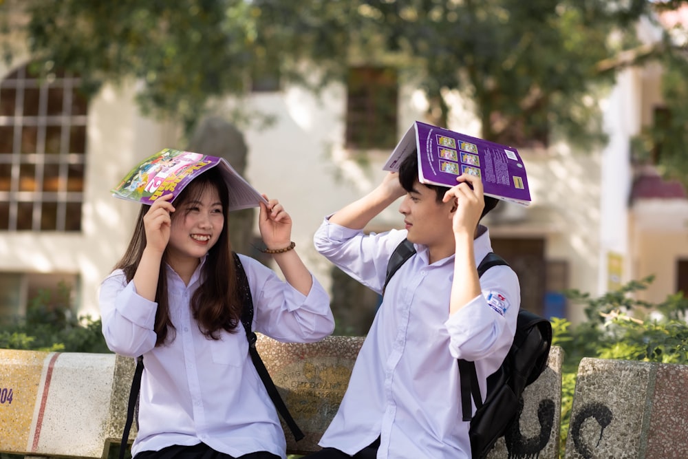 a couple of people that are sitting on a bench