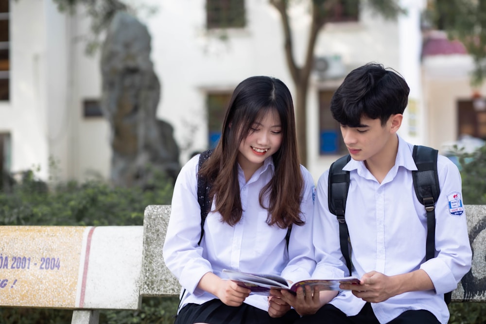 a couple of people sitting on a bench