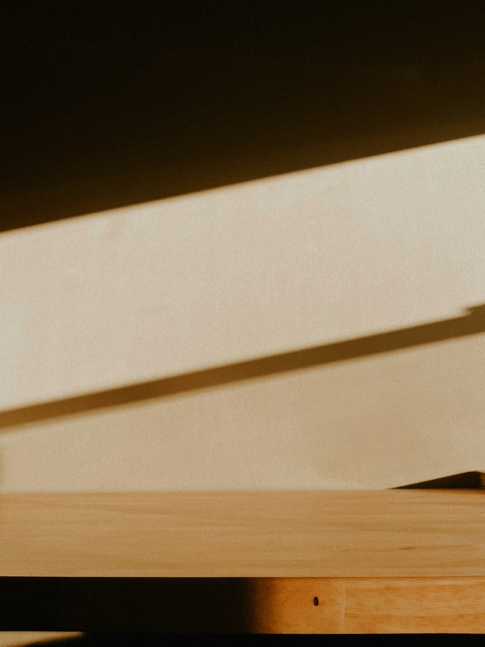 a cup of coffee sitting on top of a wooden table