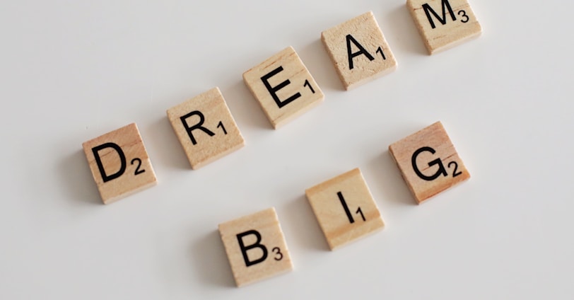 scrabble letters spelling dream, dream, and blg