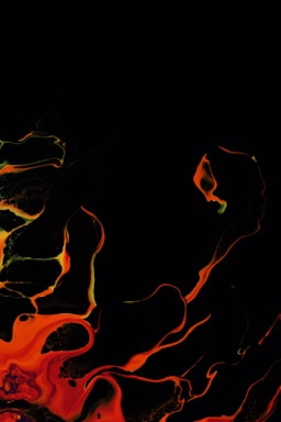 Abstract black and orange geometric shapes swirling dynamically on a white background