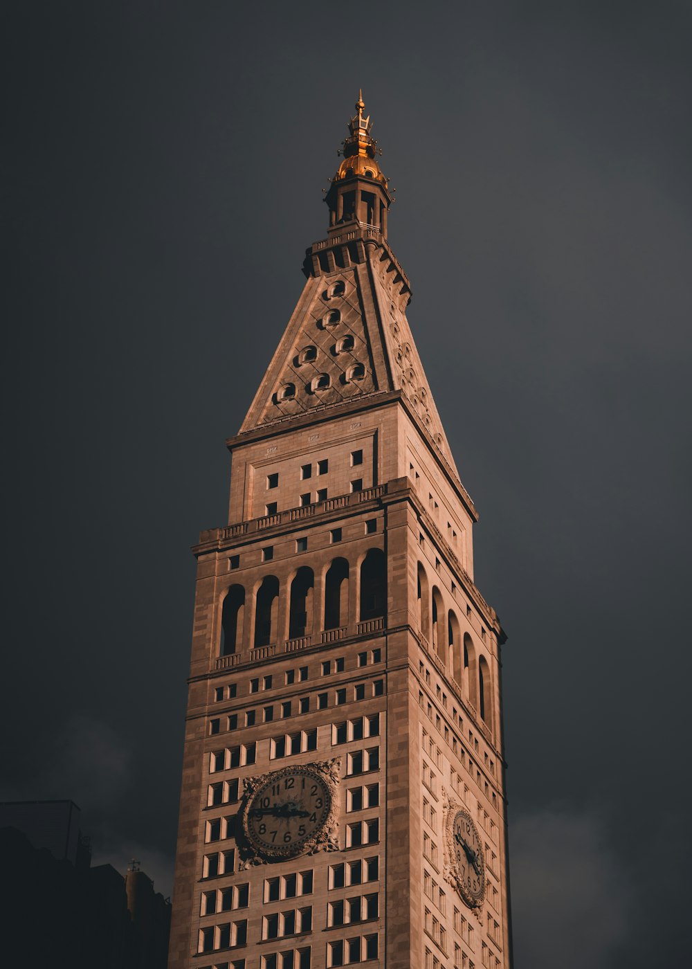 a very tall building with a clock on it's side