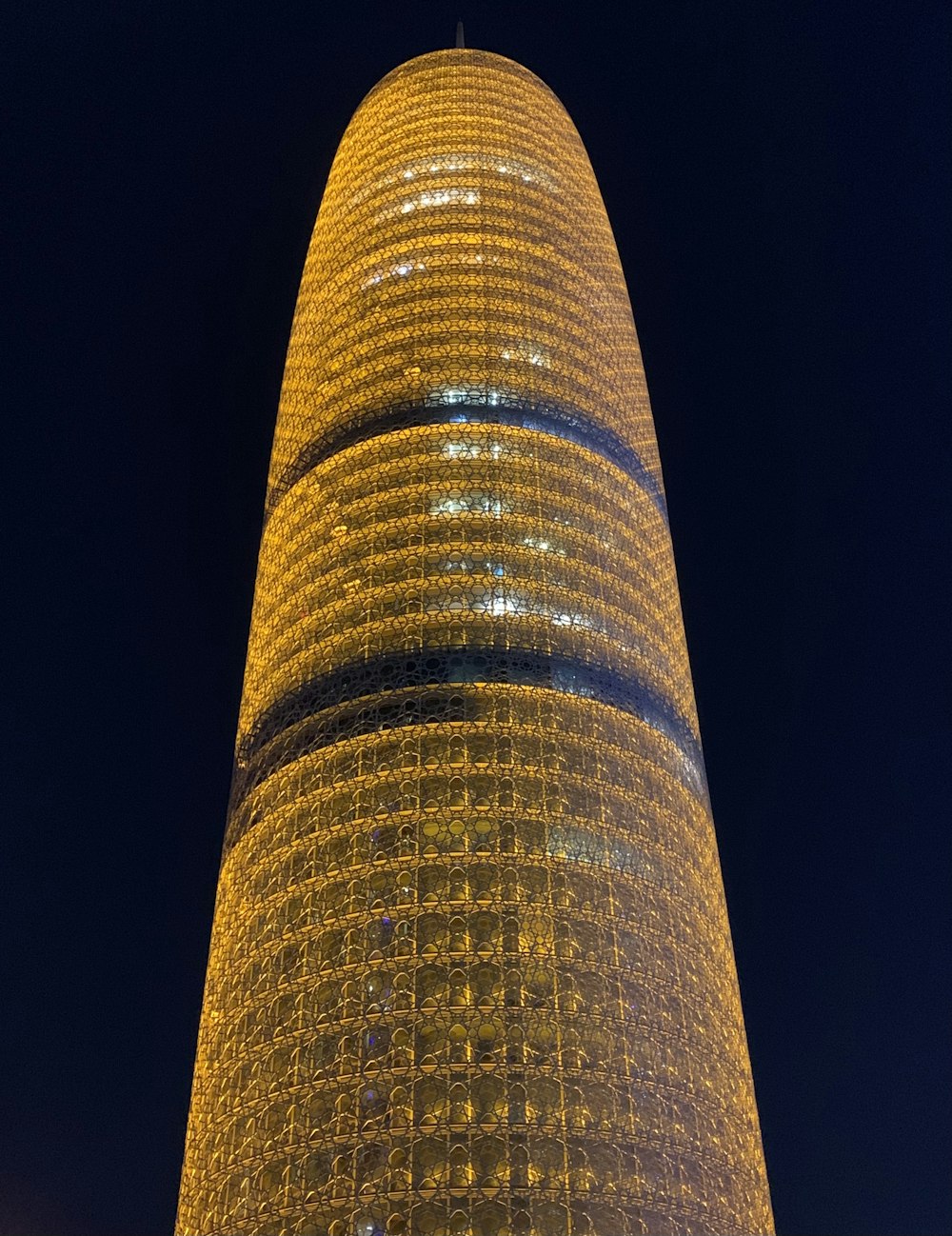 a very tall building with a clock on it's side