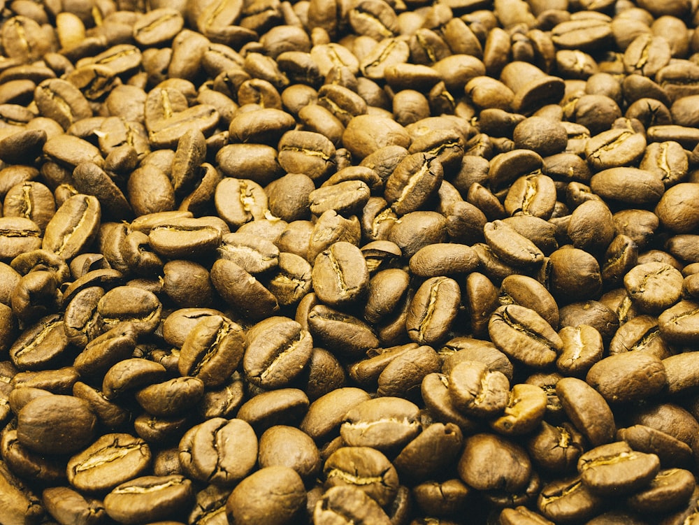 a pile of coffee beans sitting on top of each other