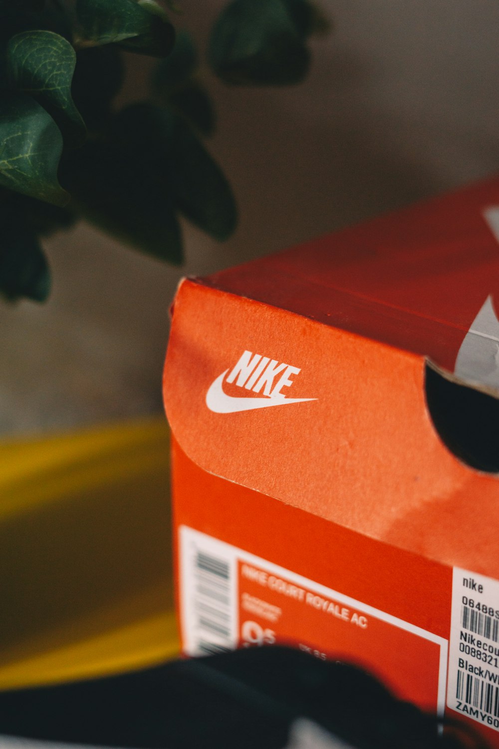 a red box with a white nike logo on it