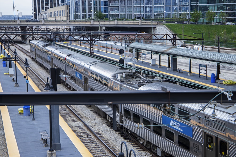 a train station with several trains on the tracks