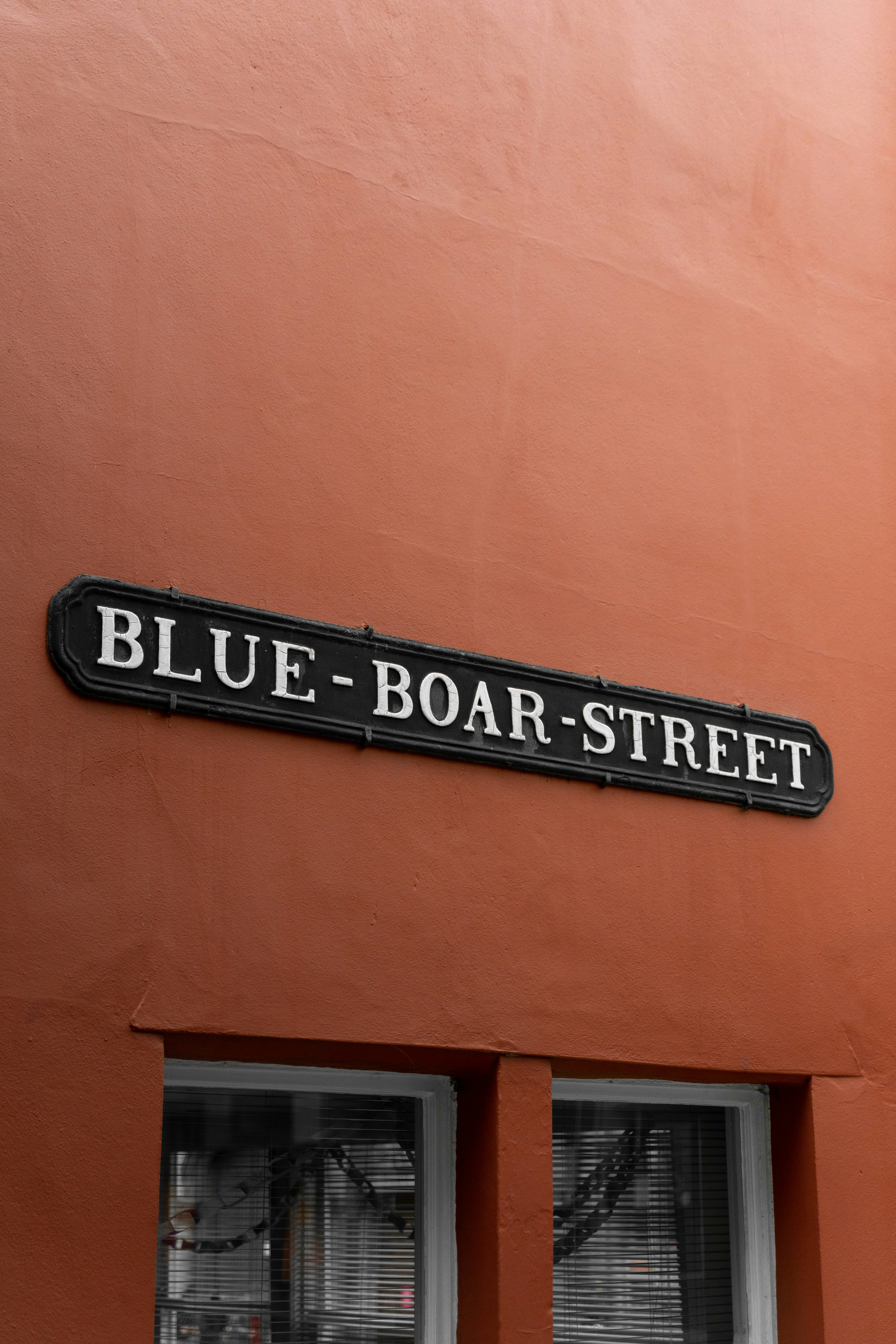 A sign on the side of a building photo – Free Building Image on Unsplash