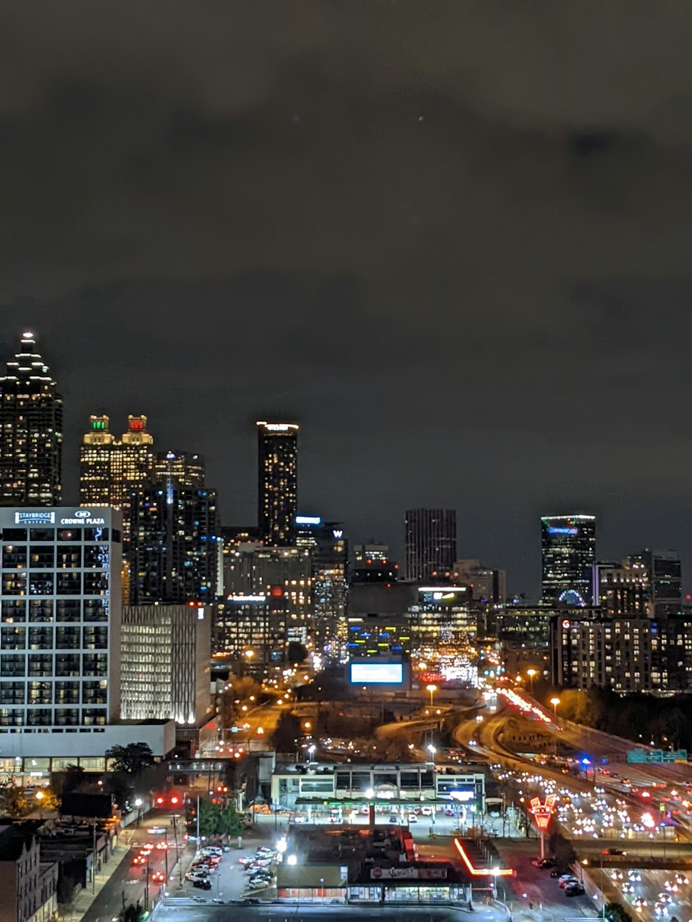 a view of a city at night from the top of a building