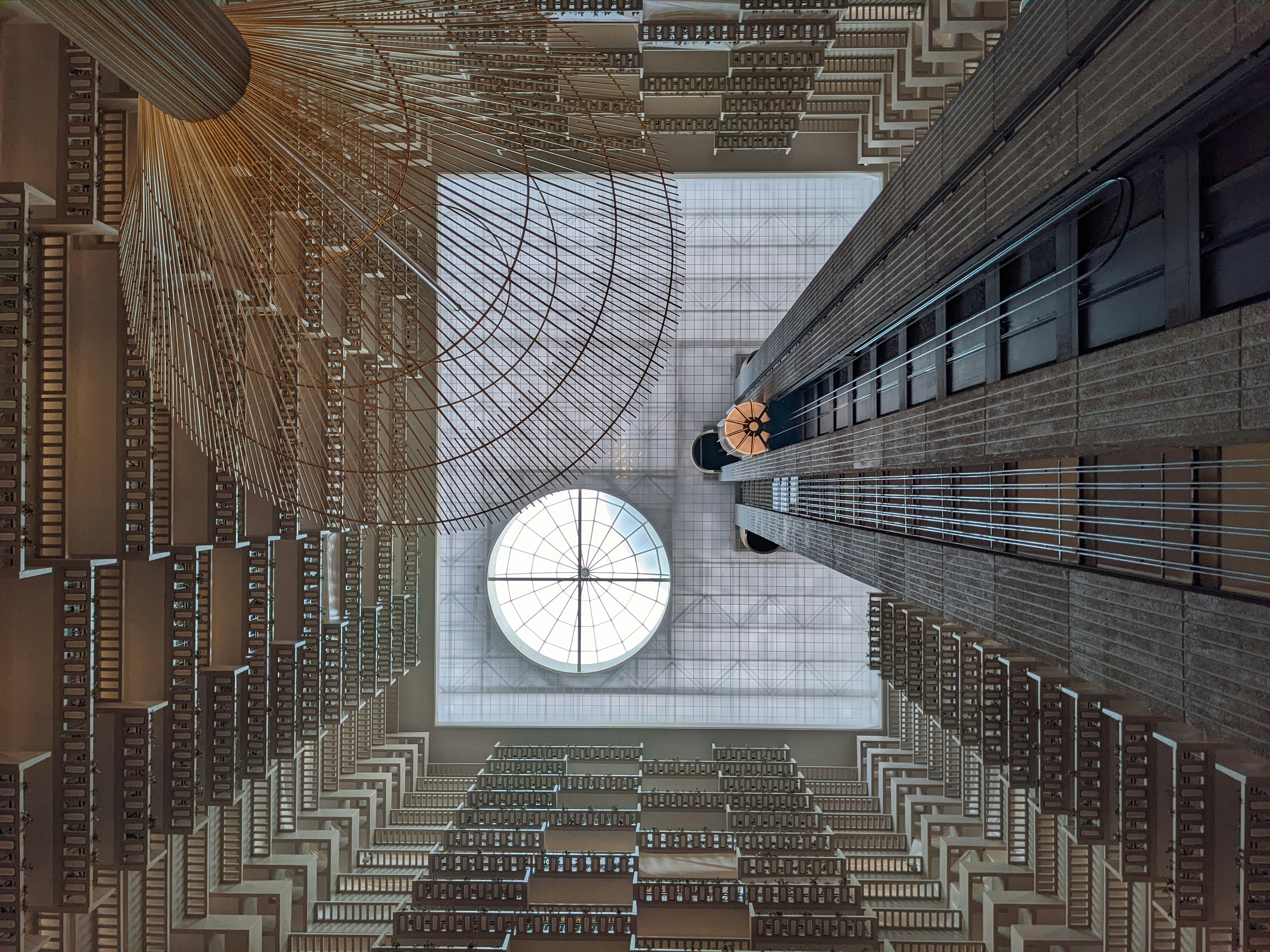 a person standing in a room with a circular window, 