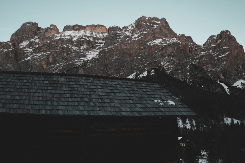 a house with a mountain in the background