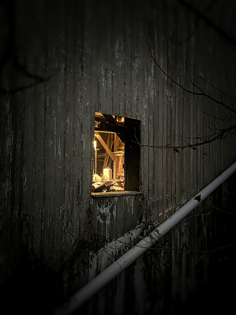 a window in the side of a building at night