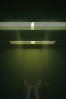 A softly lit photo of a minimalistic outfit on a mannequin in a bright, airy room with neutral tones.