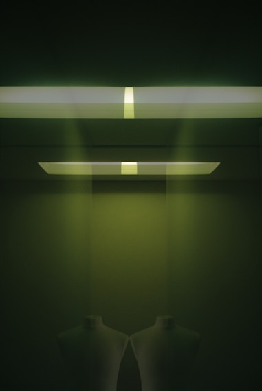 A softly lit photo of a minimalistic outfit on a mannequin in a bright, airy room with neutral tones.