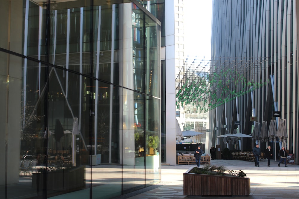 a building with a lot of windows and a bench in front of it